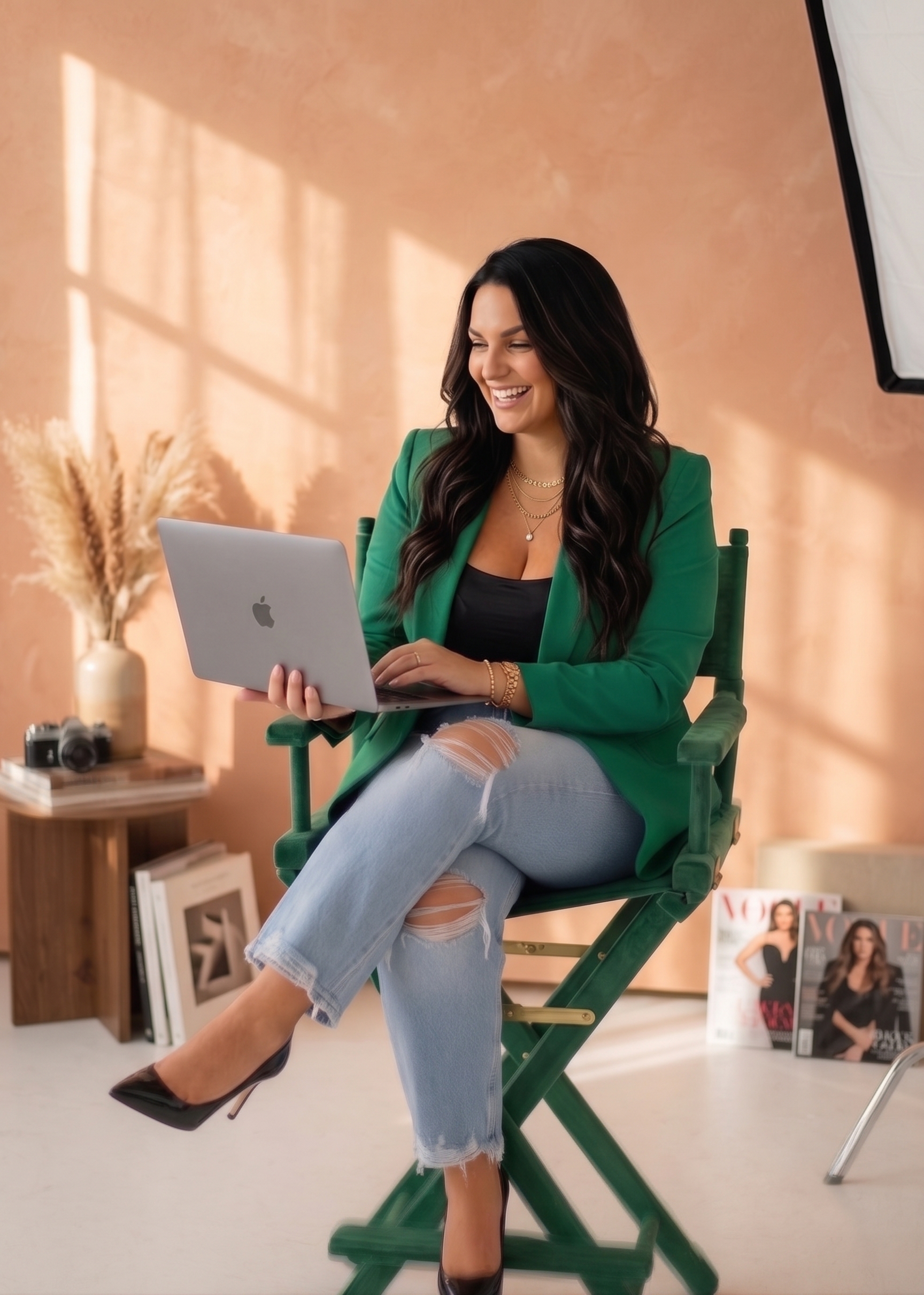 Deanna, the founder of Beyond Faceless, smiling while working on her laptop